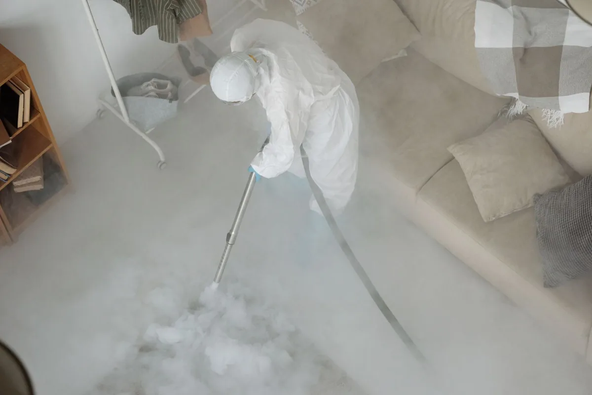 Biohazard cleanup technician in protective equipment, Miamitown, OH